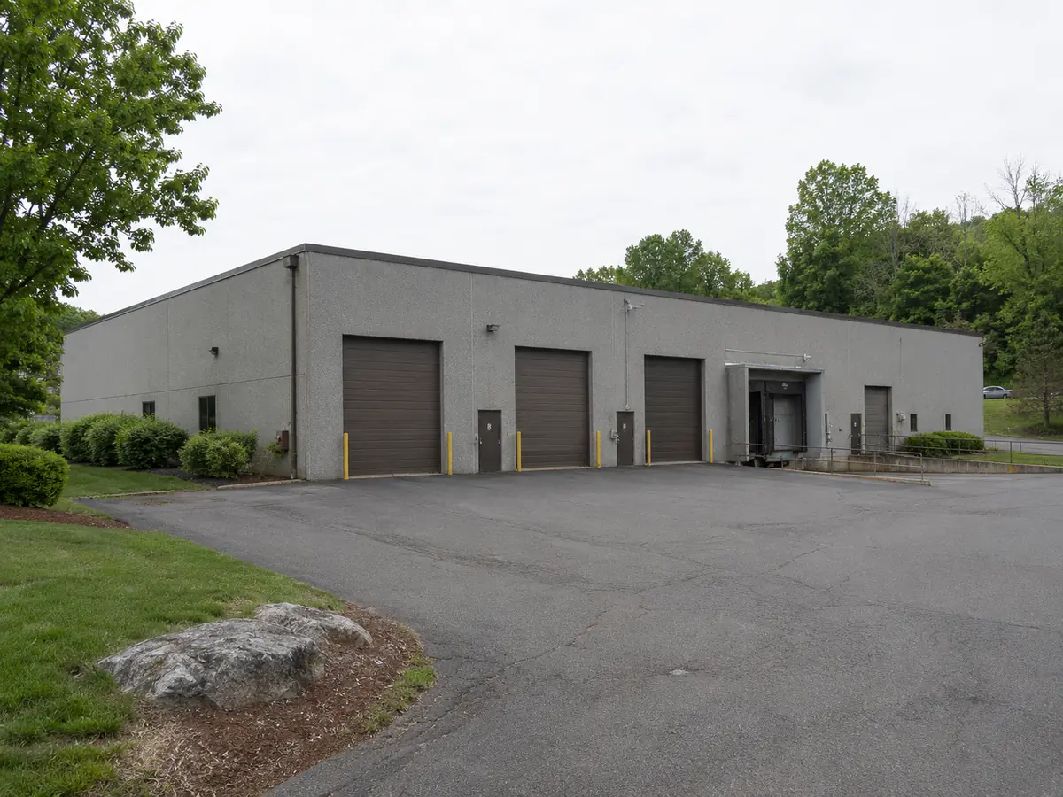 Single-story industrial flex building with grade-level drive-in and loading-dock doors